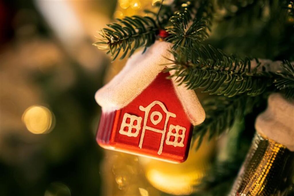 Red house ornament on a Christmas tree for Chelton Brown's festive landlord guide in Northamptonshire.